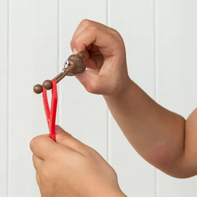 Sticky poo slingshot