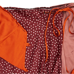 Shop from Crisis Online Planet Soph upcycled asymmetric skirt in burgundy polka dot and orange fabric with tie waist.