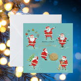 Crisis Dancing Santas Christmas Cards - Pack of 8