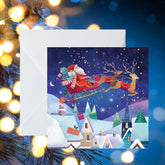 Crisis Santa Flying Over Village Christmas Cards - Pack of 8