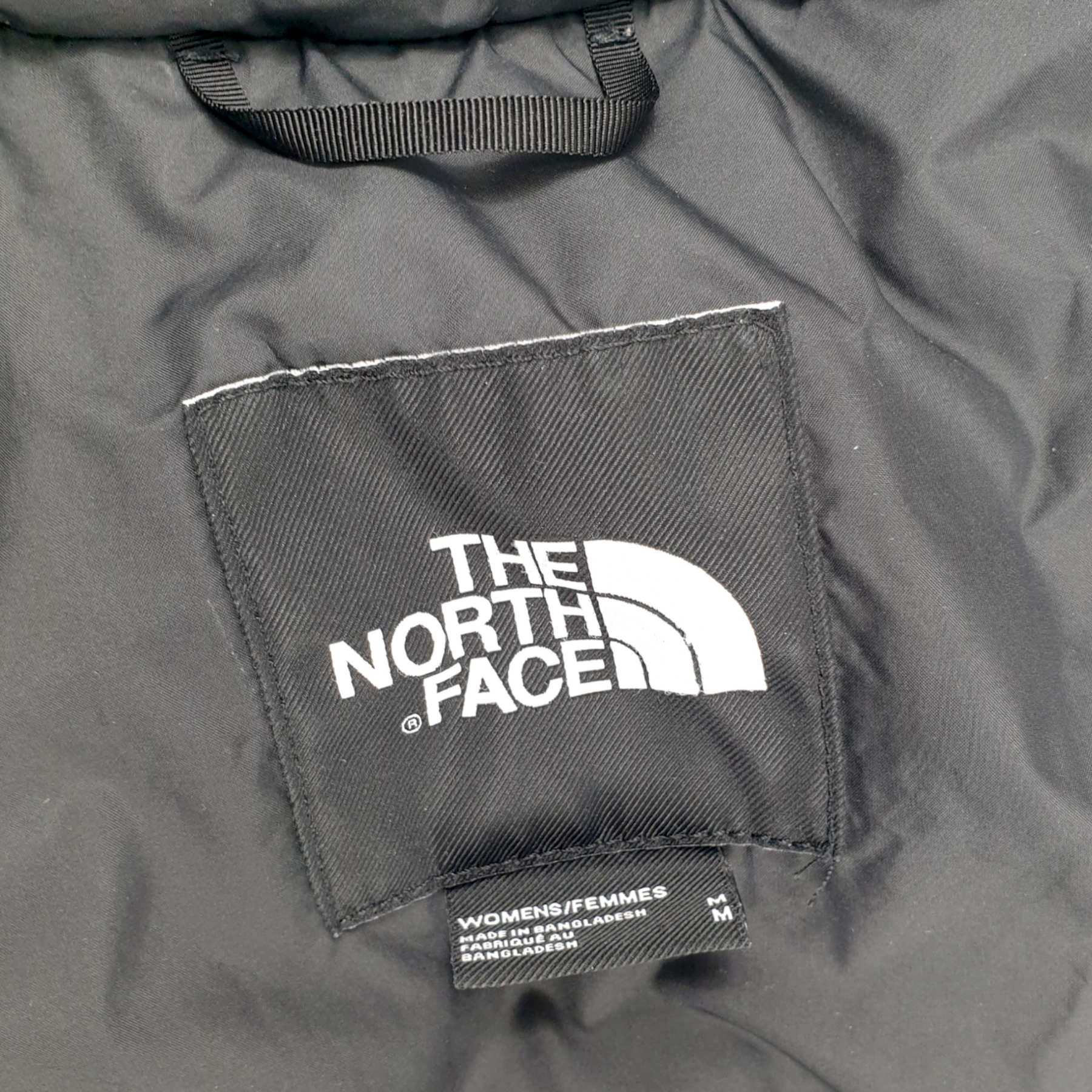 North face nuptse black 2025 label